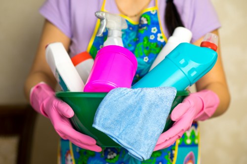 Carpet cleaning professional preparing equipment for a booked service