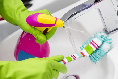 Deep cleaning kitchen surfaces and cupboards in a Wandsworth move-in property